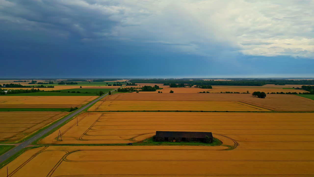 Farmhouse Amidst Agricultural Land During Sunset. Aerial Shot