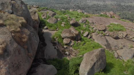 aerial shot exploring large granite boulders in tropical east africa