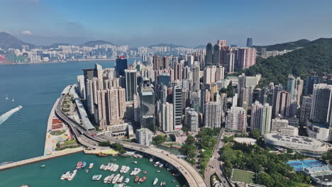 an aerial view of a city with boats in the water