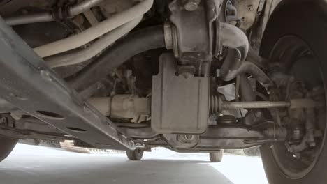 view under the pickup truck is running.