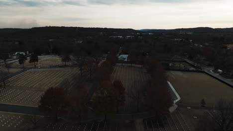 Establishing-aerial-of-Fayetteville-National-Cemetery-in-Autumn-fall,-twilight