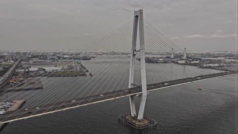 Nagoya-Japan-Aerial-v8-birds-eye-view-flyover-harbor-port-capturing-Meiko-Chuo-roadway-bridge-traffic,-views-of-Shiomicho-industrial-sector-on-a-gloomy-day---Shot-with-Mavic-3-Pro-Cine---October-2023