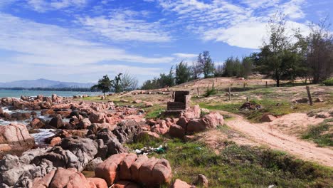 aerial view dolly of the rocky on the beach in lam dong