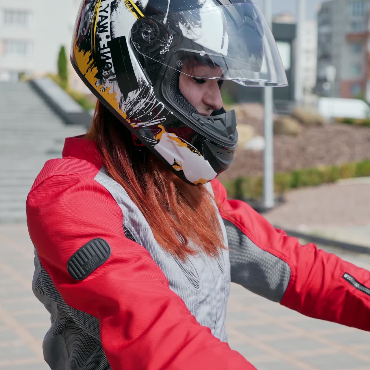 . Fashion female biker. Sexy biker lady in leather jacket sits on motorbike
