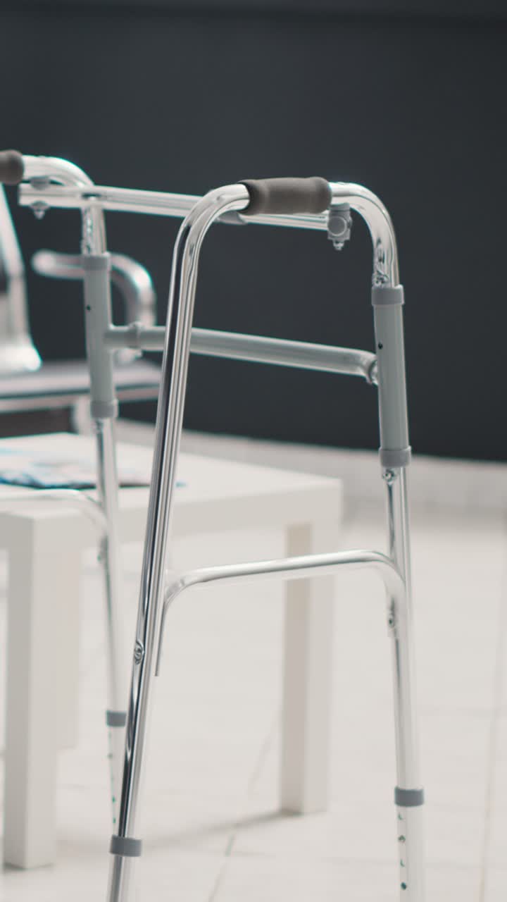 Vertical video: Walking frame in empty hospital lobby