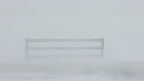 cattle fence in snow blizzard