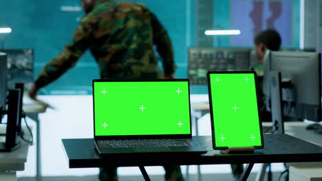 Laptop-with-green-screen-display-running-in-military-base-of-operations