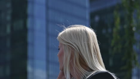 woman giving up to date news using her cellphone