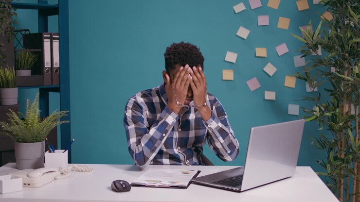 Frustrated worker feeling exhausted about office work