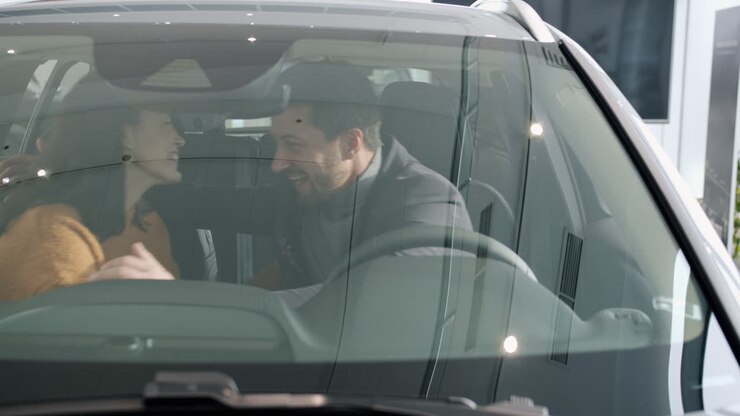 Happy Couple Choosing a New Car