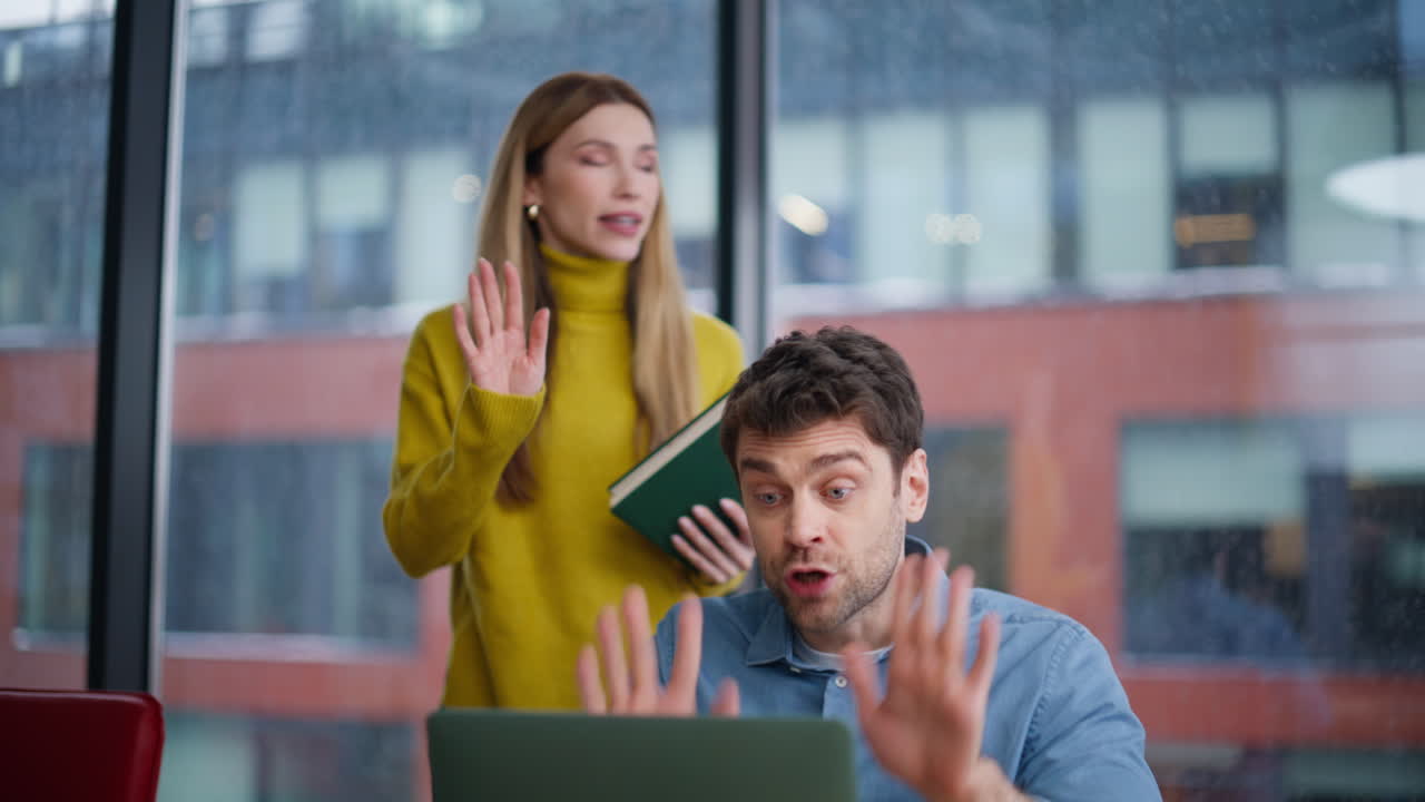 Team leader mentoring employee explaining work mistakes in office closeup