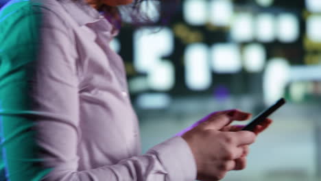 woman on phone walking downtown