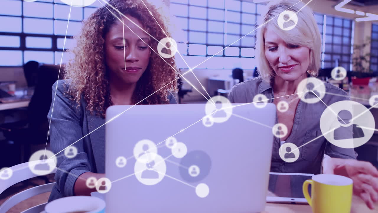 Network of connection icons against people working in office