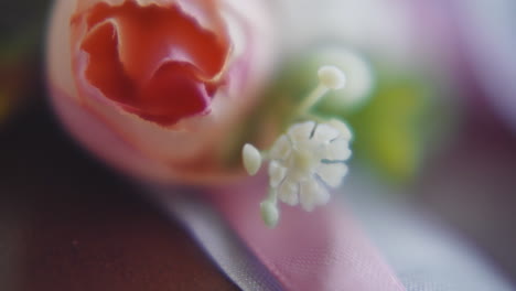 gentle flowers and silk ribbons on table at wedding event