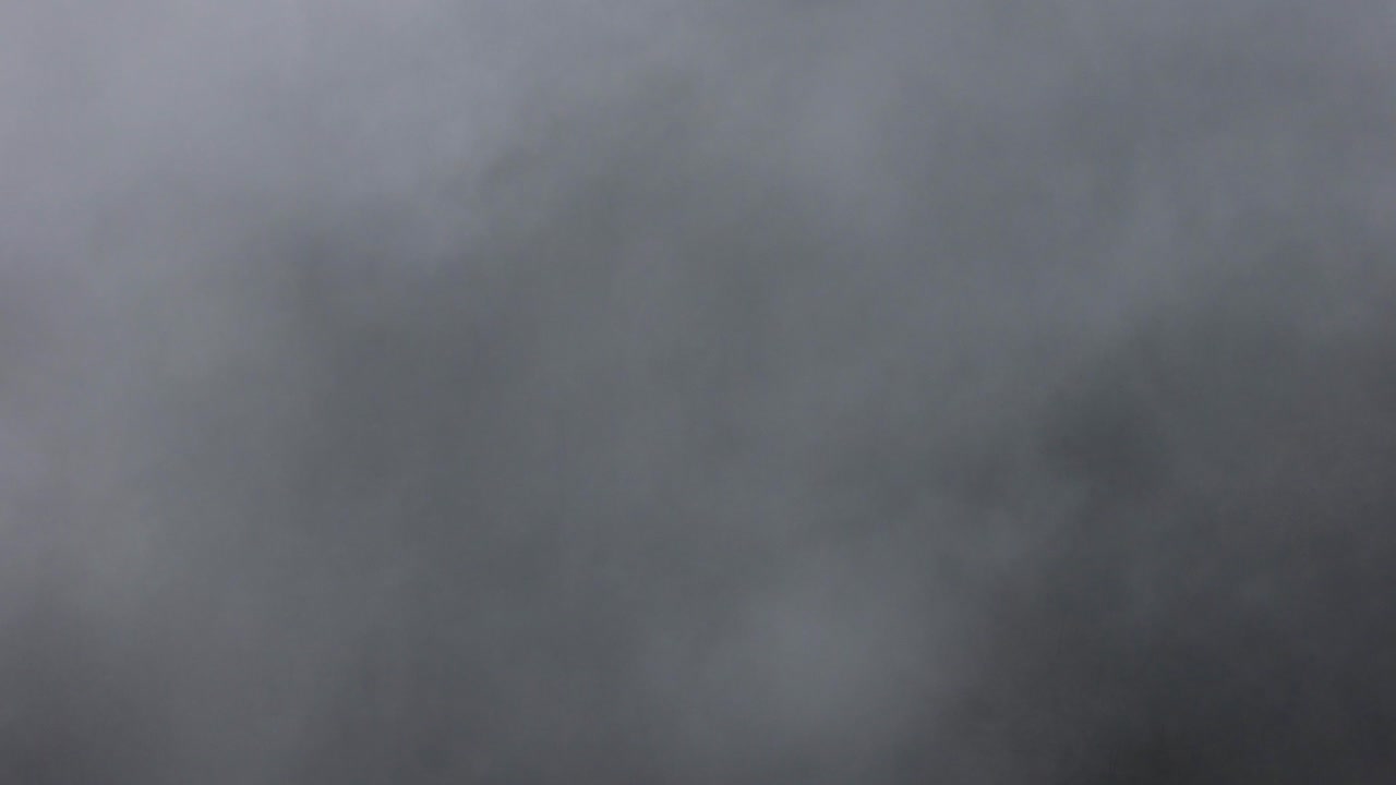 Aerial shot flying through a cloud bank over Paso de Cortés in Mexico