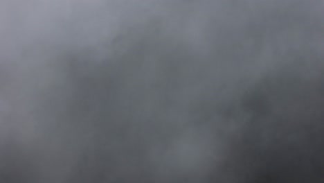 aerial shot flying through a cloud bank over paso de cortés in mexico