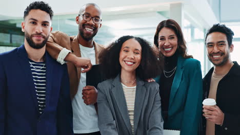 a diverse team of business professionals smiling in an office setting