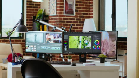 clean modern desk setup in a living room designed for media production