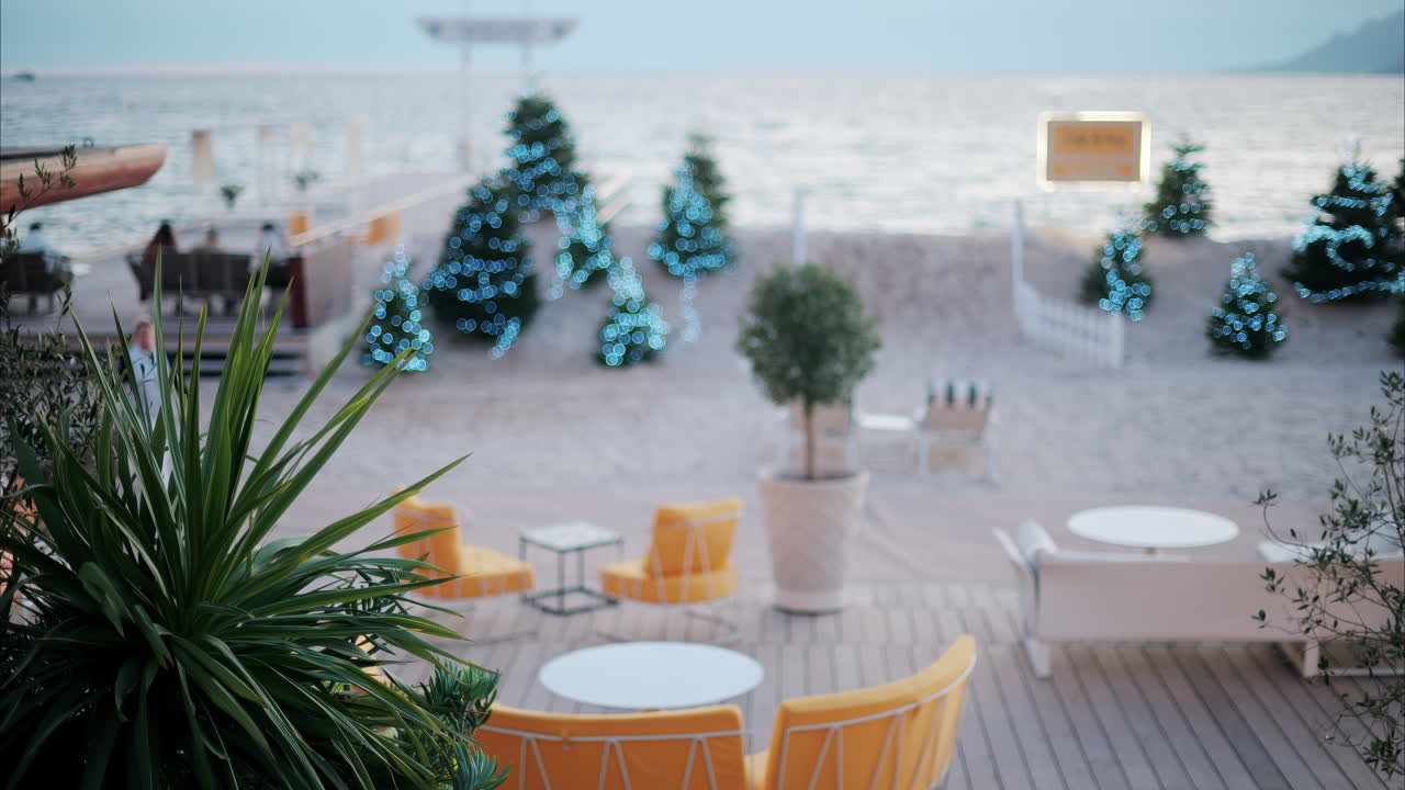 Decorated Christmas trees on a beach at a resort in Cannes, France