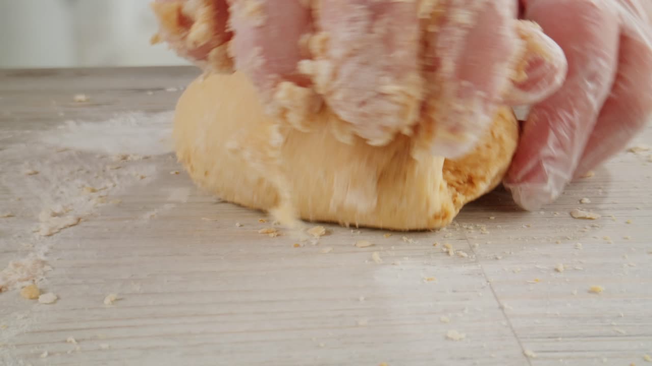 Close-up of Hands Kneading Dough for Baking
