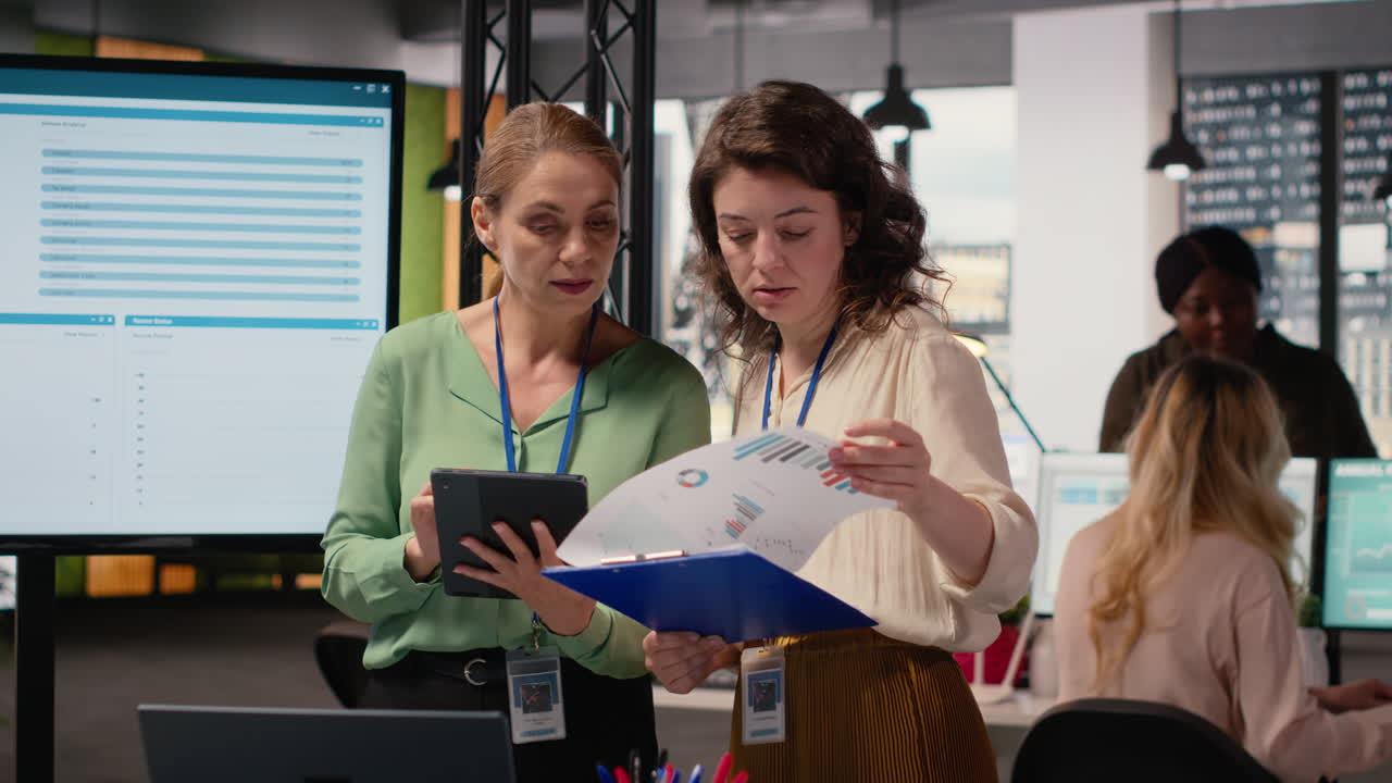 Vertical Video Ambitious professionals demonstrating teamwork to build business strategy