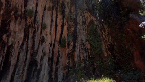 close tilting up shot of weeping rock at zion national park