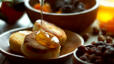 close up, honey dripping down a pancake stack