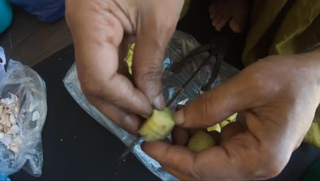 Fresh-Ginger-Being-Cut-On-Traditional-Vegetable-Cutter