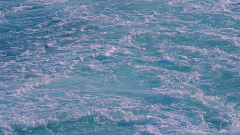 slow motion view of large ferry wake with white water swirling in hypnotic style 4k