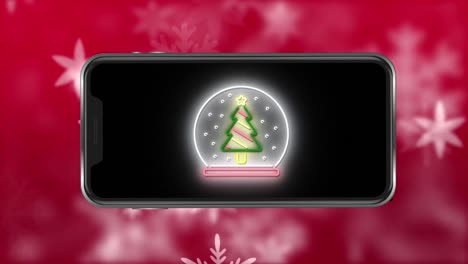 Animation-of-christmas-tree-on-smartphone-over-snow-falling