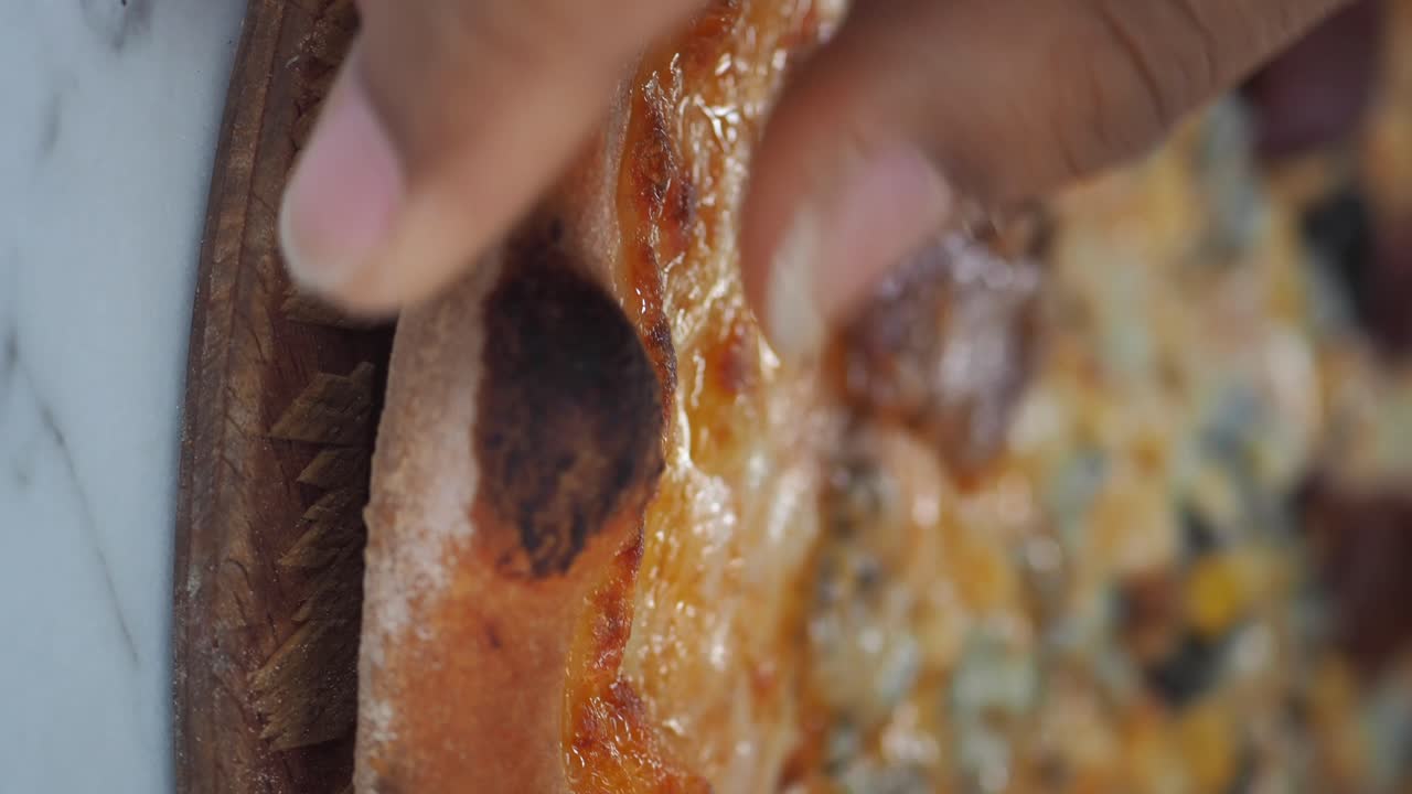 Close-up of a slice of pizza with blue cheese