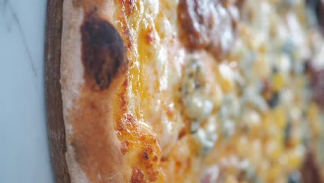 close-up of a slice of pizza with blue cheese