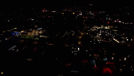 expansive nighttime aerial view of city lights and streets