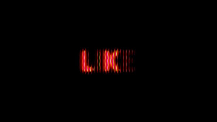 Flickering Pixelated 'Like' Text on Black Background