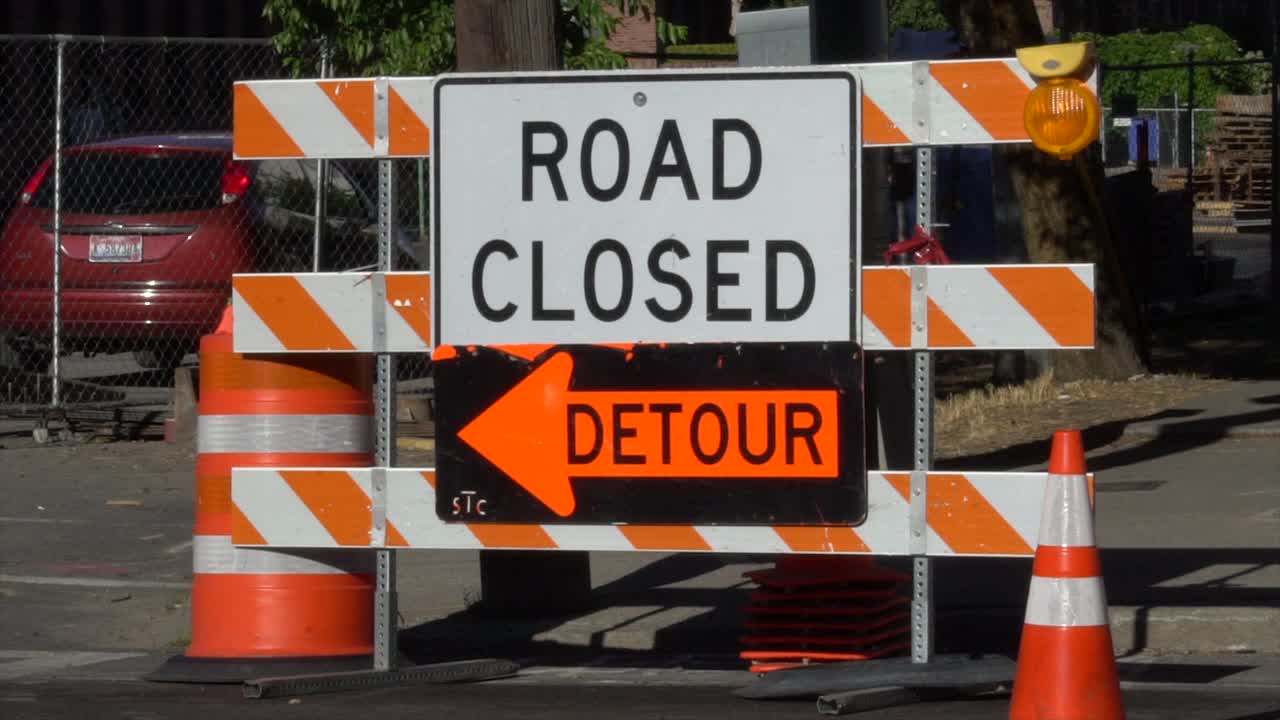 Road closed, detour sign