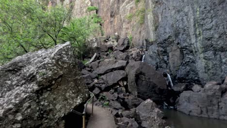 scenic view of waterfall and rocky terrain