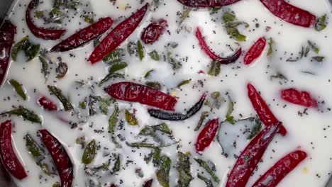 masala chaas - red and green chili pepper on buttermilk