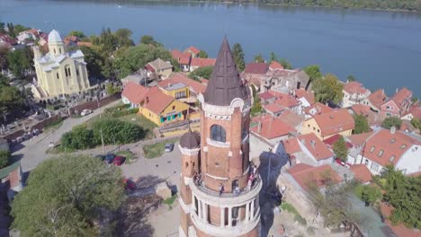 Descending-opening-aerial-shot-of-Gardos-Tower-in-Zemun-Old-city,-Belgrade