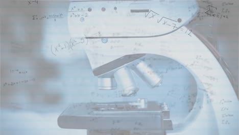 mathematical equations moving against microscope