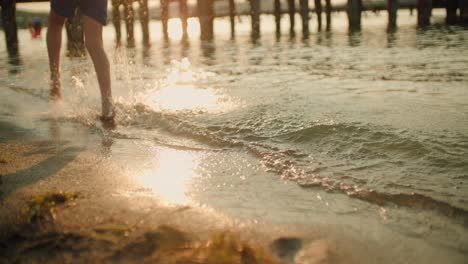 kid running on the beach slow motion