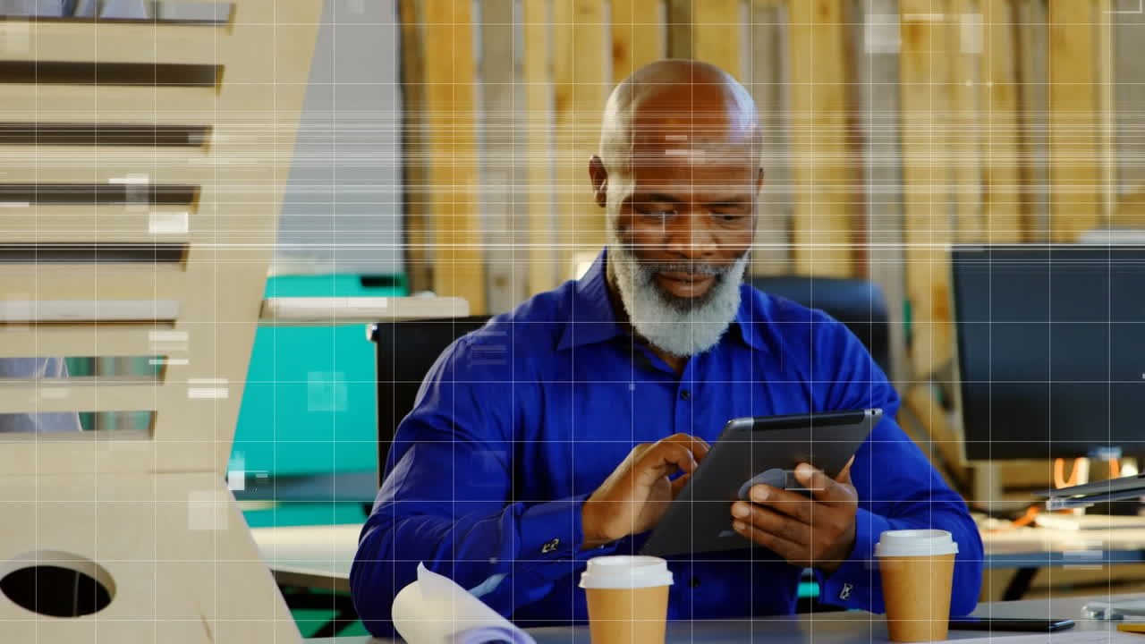 animazione di una rete di icone digitali su un uomo d'affari che utilizza un tablet computer