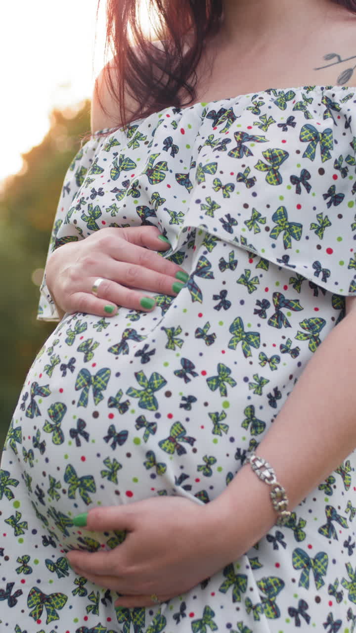 Pregnant woman in dress vertical video