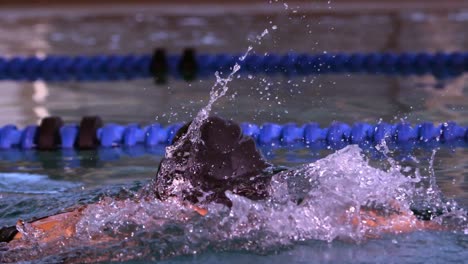 Fit-swimmer-doing-the-front-stroke-in-swimming-pool