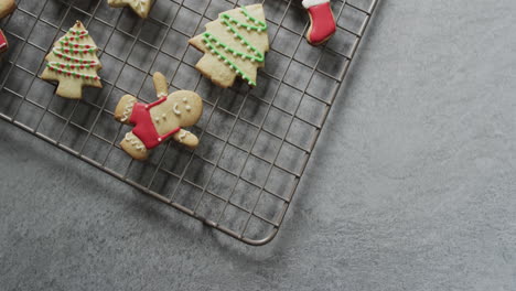 Video-of-christma-cookies-decorated-sugar-icing-with-copy-space-on-grey-background