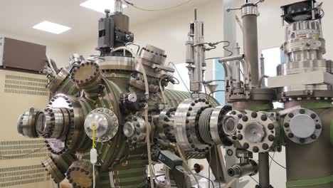 high vacuum chamber and associated equipment in a laboratory