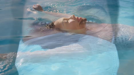 digital composite video of woman wearing face mask against woman swimming in background