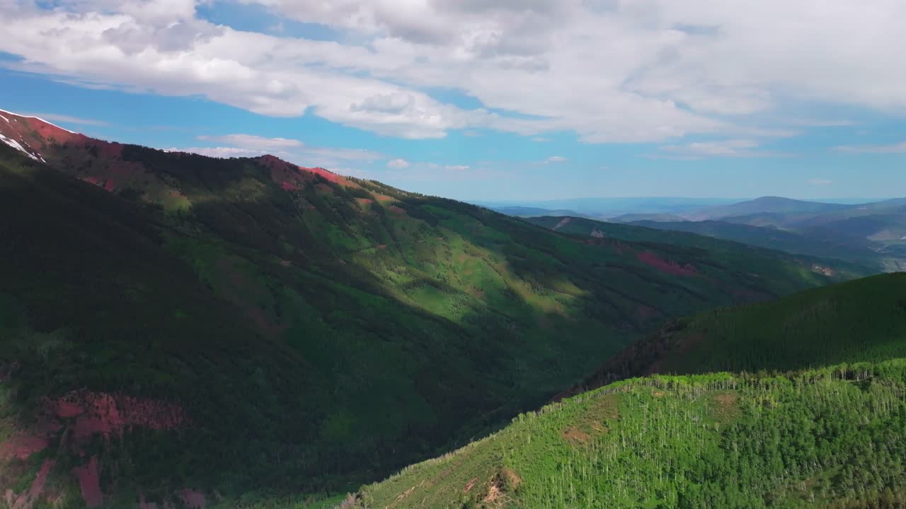 Aspen Mountain Highlands Bowl AJAX summer spring morning blue sky camping aerial drone Colorado Aspen Snowmass Airport valley hillside 4wd trail road Conundrum creek snow fields circle right