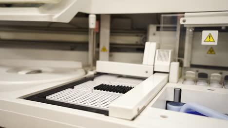 medical test tubes with blood tests on the table in the laboratory