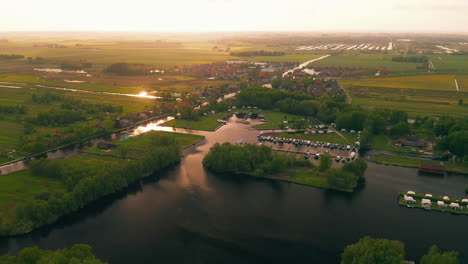 Aerial-View-Of-Marina-Near-Waterstaete-Ossenzijl-Villas-In-Ossenzijl,-Friesland,-Netherlands