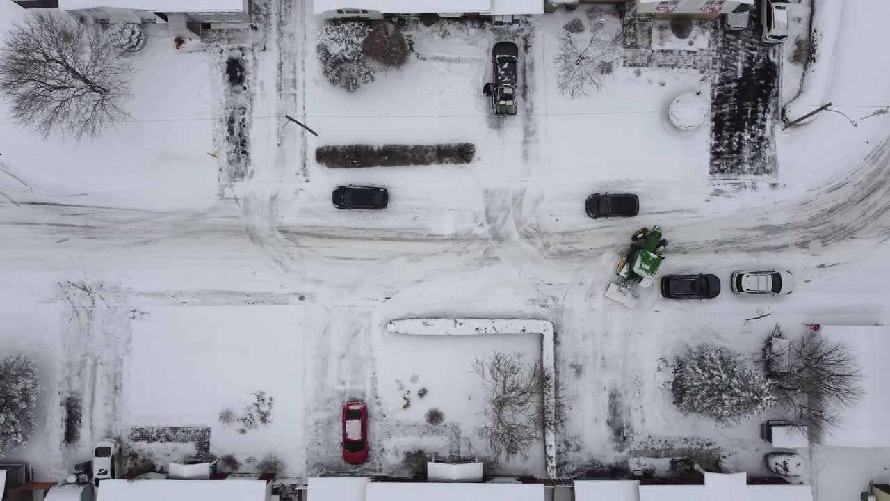 Snowplow at Work, Aerial Shot of a Vehicle Clearing Snow-Covered Urban Roads